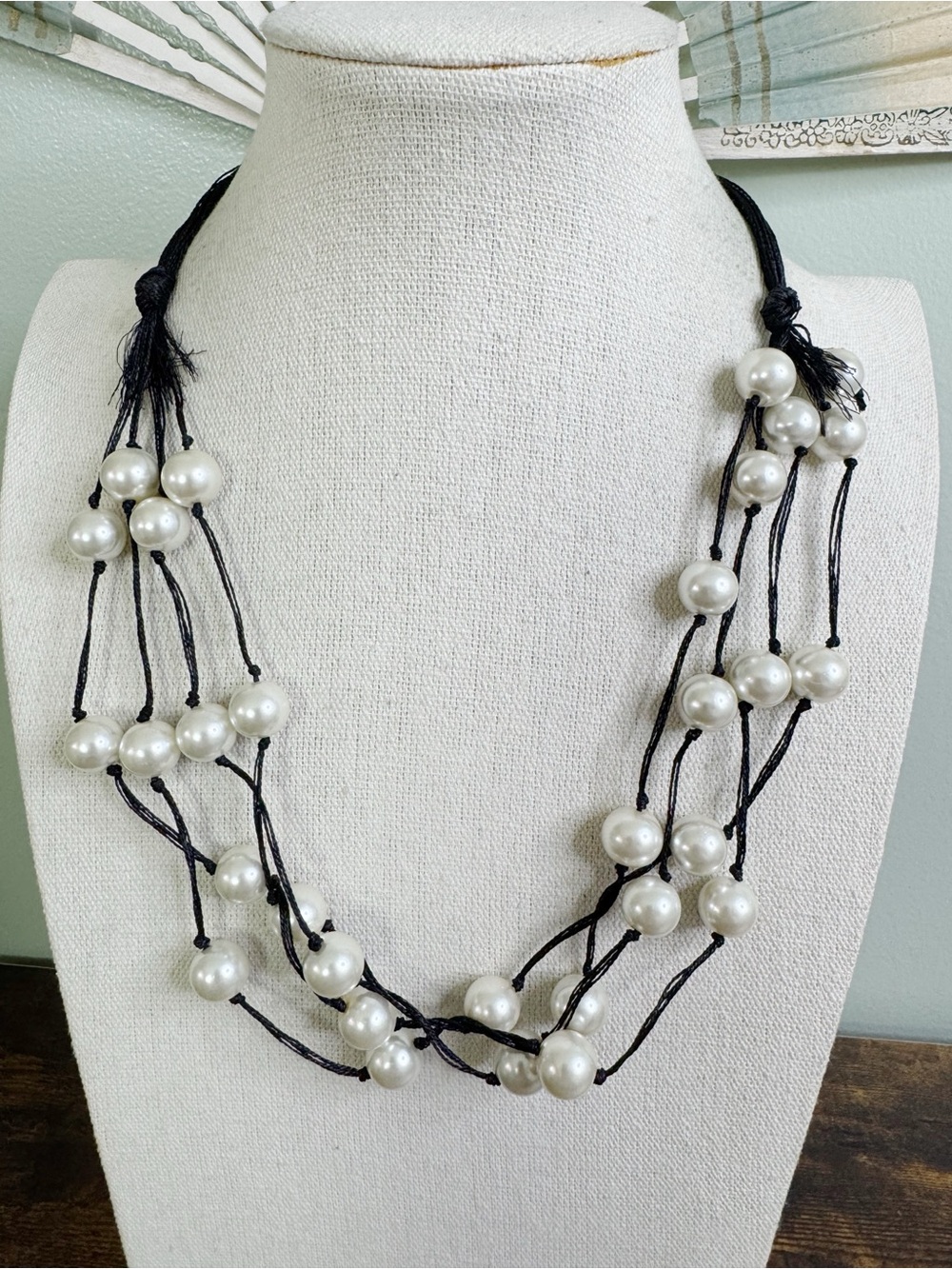 Multi-Strand Black Cord Necklace with White Glass Pearls and Tassel Accents